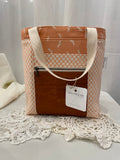 Front view of medium project tote in peach dot/bird