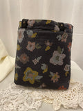 Back view of medium project tote in mustard/black floral