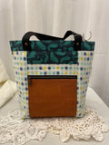Front view of medium project bag in teal dot/whales