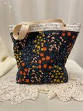 Back view of medium project tote in navy floral/script