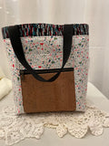 Front view of medium project tote in white/black cocktail
