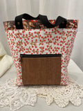 Front view of medium project bag in salmon/brown buds