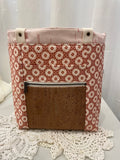 Front view of medium project tote in mauve/pink graphic