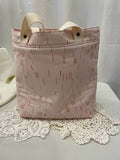 Back view of medium project tote in pink/mauve graphic