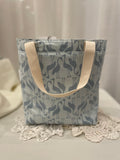 Back view of medium project tote in grey/blue stork