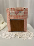 Front view of medium project tote in peach graphic floral